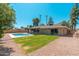 Beautiful backyard featuring refreshing pool, patio and low maintenance desert landscaping at 1810 W Orchid Ln, Phoenix, AZ 85021