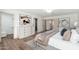 Bright bedroom featuring a contemporary dresser, ensuite bathroom and walk in closet at 1810 W Orchid Ln, Phoenix, AZ 85021