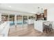 Bright living space opens to a refreshing pool through sliding glass doors at 1810 W Orchid Ln, Phoenix, AZ 85021