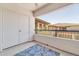 A bright, covered balcony with a blue leafy rug and a view of the community at 20121 N 76Th St # 2021, Scottsdale, AZ 85255