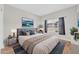 Comfortable bedroom with a padded headboard, a large window, and a decorative rug at 20121 N 76Th St # 2021, Scottsdale, AZ 85255