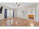 Spacious bedroom featuring wood-look floors, ample natural light, and an ensuite bathroom at 20121 N 76Th St # 2021, Scottsdale, AZ 85255