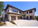 A spacious home with a three-car garage, well-manicured landscaping, and neutral color palette at 20121 N 76Th St # 2021, Scottsdale, AZ 85255