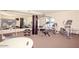 Bright fitness center with a variety of exercise equipment and mirrored walls at 20121 N 76Th St # 2021, Scottsdale, AZ 85255