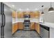 Galley-style kitchen featuring stainless steel appliances, wood cabinets, and white countertops at 20121 N 76Th St # 2021, Scottsdale, AZ 85255