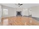Bright living room with hardwood flooring, a fireplace, and easy access to other rooms at 20121 N 76Th St # 2021, Scottsdale, AZ 85255