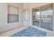 Cozy patio with sliding glass doors and a leafy rug at 20121 N 76Th St # 2021, Scottsdale, AZ 85255