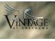 The 'Vintage at Grayhawk' sign is displayed with an artistic bird emblem, enhancing community's upscale branding at 20121 N 76Th St # 2021, Scottsdale, AZ 85255