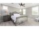 A bedroom that has plenty of natural light, laminated floors, ceiling fan and decorative bed at 20576 W Briarwood Dr, Buckeye, AZ 85396