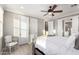 A bedroom that has laminated floors, ceiling fan and decorative bed at 20576 W Briarwood Dr, Buckeye, AZ 85396