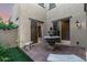 Private courtyard boasts a tiered stone fountain and access via two sliding glass doors at 20576 W Briarwood Dr, Buckeye, AZ 85396
