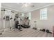Home gym featuring fitness equipment, white trim, neutral paint, and bright lighting at 20576 W Briarwood Dr, Buckeye, AZ 85396