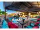 Relaxing backyard gazebo with comfortable lounge seating, overlooking the pool and backyard at 20576 W Briarwood Dr, Buckeye, AZ 85396