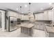 Well-equipped kitchen with stainless steel appliances, custom cabinetry, and granite countertops at 20576 W Briarwood Dr, Buckeye, AZ 85396