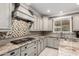 Beautiful kitchen featuring stainless steel appliances, custom cabinets and granite countertops at 20576 W Briarwood Dr, Buckeye, AZ 85396