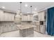 A gourmet kitchen with updated appliances, custom cabinets, granite countertops, and center island at 20576 W Briarwood Dr, Buckeye, AZ 85396