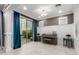 Stylish living room showcasing paneled walls, elegant decor, and a sliding door leading to an outdoor area at 20576 W Briarwood Dr, Buckeye, AZ 85396