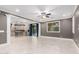 Spacious living room featuring tile floors, recessed lights, and plenty of natural light at 20576 W Briarwood Dr, Buckeye, AZ 85396