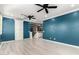 A living room that has laminated floors and a ceiling fan at 20576 W Briarwood Dr, Buckeye, AZ 85396