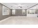 Expansive living room featuring tile floors, recessed lights, and multiple windows at 20576 W Briarwood Dr, Buckeye, AZ 85396
