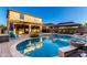 Backyard featuring a beautiful pool with water features and a gazebo, perfect for outdoor relaxation at 20576 W Briarwood Dr, Buckeye, AZ 85396