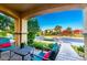 Relaxing front porch with comfortable seating, vibrant plants, and a view of the neighborhood street at 20576 W Briarwood Dr, Buckeye, AZ 85396