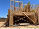 Framing of a new two story home under construction with a two-car garage in a residential area at 21075 N 58Th St, Phoenix, AZ 85054