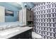 Bathroom with a large vanity mirror and patterned shower curtain at 2110 W Morrow Dr, Phoenix, AZ 85027