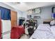 A bedroom showcasing a workspace and additional sleeping arrangements at 2110 W Morrow Dr, Phoenix, AZ 85027