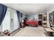 Bedroom with doors to outside and simple decor, including a rug and wooden accents at 2110 W Morrow Dr, Phoenix, AZ 85027