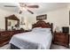 Cozy bedroom with a ceiling fan and hardwood furniture at 2110 W Morrow Dr, Phoenix, AZ 85027