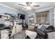 Bedroom with ceiling fan, desk space, and a gray sofa at 2110 W Morrow Dr, Phoenix, AZ 85027
