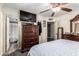 Bedroom featuring a ceiling fan and TV mounted above a dresser at 2110 W Morrow Dr, Phoenix, AZ 85027