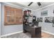 Bedroom features neutral walls, gray carpet, and a desk for a functional space at 2110 W Morrow Dr, Phoenix, AZ 85027