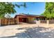 Spacious driveway with covered parking, solar panels, and mature landscaping at 2110 W Morrow Dr, Phoenix, AZ 85027