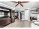 Comfortable living room area with wood-look floors and ceiling fan at 2110 W Morrow Dr, Phoenix, AZ 85027