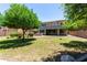 The expansive backyard features lush landscaping and a covered patio at 2116 W Fawn Dr, Phoenix, AZ 85041