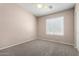 Neutral bedroom with carpet and ceiling fan provides a calm and comfortable space at 2116 W Fawn Dr, Phoenix, AZ 85041