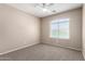 Neutral bedroom with carpet and ceiling fan provides a calm and comfortable space at 2116 W Fawn Dr, Phoenix, AZ 85041