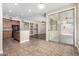 Open kitchen and living area with a large sliding glass door to the patio at 2116 W Fawn Dr, Phoenix, AZ 85041