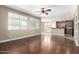Open living room features hardwood floors, large windows, and a ceiling fan at 2116 W Fawn Dr, Phoenix, AZ 85041