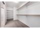 Walk-in closet with shelving and rods for ample storage at 2116 W Fawn Dr, Phoenix, AZ 85041