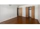 Bedroom featuring a closet and two doors, offering ample storage and easy access at 230 E Fairmont Dr, Tempe, AZ 85282
