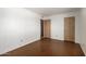 A simple bedroom featuring neutral walls and a standard door at 230 E Fairmont Dr, Tempe, AZ 85282