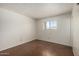 Bright bedroom with a large window, neutral walls and flooring creating a cozy space at 230 E Fairmont Dr, Tempe, AZ 85282