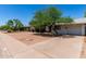 Quaint home with a mature tree, gravel landscaping, and a concrete driveway at 230 E Fairmont Dr, Tempe, AZ 85282