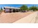 Charming home with neat landscaping, gravel yard, and convenient sidewalk access at 230 E Fairmont Dr, Tempe, AZ 85282
