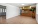 Spacious living room connected to kitchen featuring a large window providing natural light and tile floors at 230 E Fairmont Dr, Tempe, AZ 85282