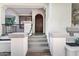 Inviting front entrance with a dark wood door, concrete steps, and elegant details at 2774 E Valencia St, Gilbert, AZ 85296