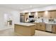 Kitchen with an island, white countertops, and stainless steel appliances at 2774 E Valencia St, Gilbert, AZ 85296